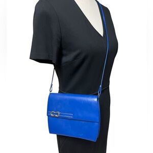 Orley ?? Very vintage leather royal  blue purse in excellent condition. Chic!